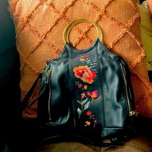 INC  pocketbook gently used. Pretty  flowers on the front of it